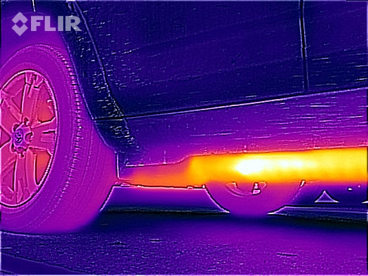 Thermal image of undercarriage of a car in the garage.